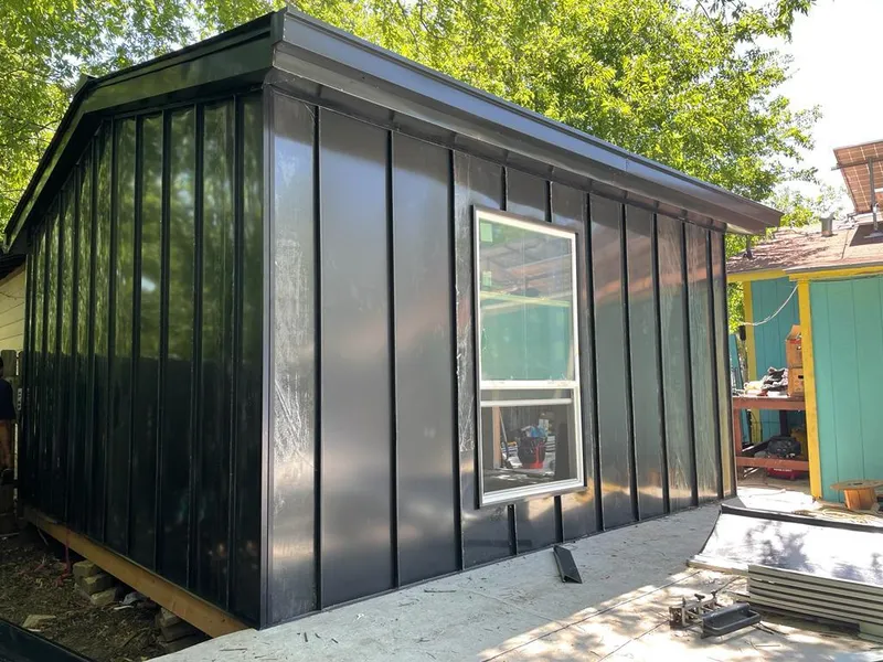 Black standing seam metal wall panels for Roof Inspection in South Gate Ridge